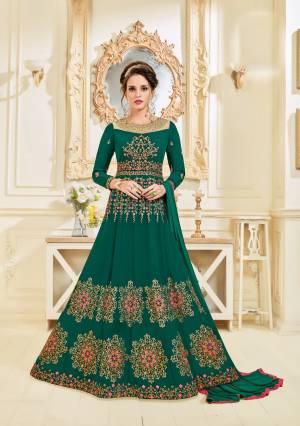 Get Ready For The Next Occasion At Your Place With This Designer Floor Length Suit In Pine Green Color Paired With Pine Green Colored Dupatta. Its Top Is Fabricated On Georgette Paired With Santoon Bottom And Chiffon Dupatta. It Is Beautified With Heavy Contrasting Colored Embroidery. Buy It Now.