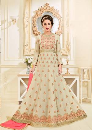 Simple And Elegant Looking Designer Floor Length Suit Is Here In Beige Colored Top Paired With Peach Colored Bottom And Dupatta. Its Top Is Fabricated On Georgette Paired With Santoon Bottom And Chiffon Dupatta. This Pretty Elegant Looking Suit Will Definitely Earn You Lots Of Compliments From Onlookers.