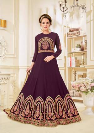 Add This Lovely Dark Shade To Your Wardrobe With This Designer Floor Length Suit In Purple Colored Top Paired With Beige Colored Bottom And Dupatta. Its Top Is Fabricated On Georgette Paired With Santoon Bottom And Chiffon Dupatta. It Has Contrasting Embroidery Over The Top Making the Suit More Attractive. Buy This Designer Suit Now.