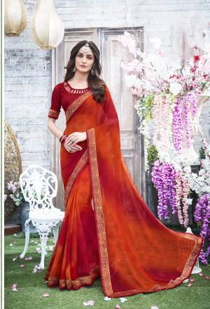 Grab This Pretty Attractive Shaded Saree In Orange And Red Color Paired With Red Colored Blouse. This Saree And Blouse Are Fabricated On Georgette Beautified with Prints And Lace Border. Buy This Simple Saree Now.