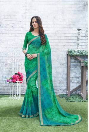 Here Is A Cool Saree In Cool Pallete, Grab This Pretty Saree In Green and Blue Color Paired With Green Colored Blouse. This Saree and Blouse Are Fabricated On Georgette Beautified With Prints And Lace Border. This Saree Is Light In weight And Easy To carry All Day Long.