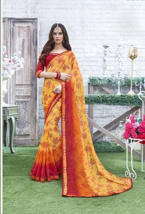 For A Perfect Summery Look, Grab This Saree In Yellow And Red Color Paired With Red Colored Blouse. This Saree And Blouse are Fabricated On Georgette Beautified With Floral Prints All Over. Buy This Saree Now.