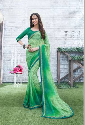 Add Some Casuals Wearing This Saree In Green Color Paired With Green Colored Blouse. This Saree And Blouse Are Fabricated On Georgette Beautified with Prints. This Saree Is Light Weight And Its Fabric Ensures Superb Comfort All Day Long.