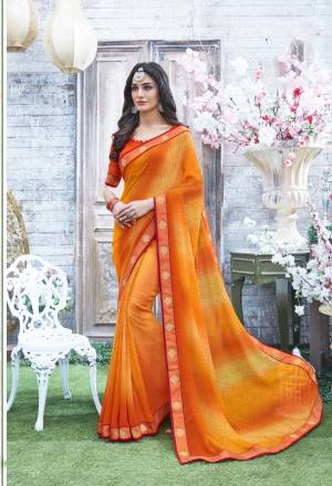 Beat The Heat With This Lovely Bright Colored Saree In Musturd Yellow And Orange Paired With Orange Colored Blouse. This Saree And Blouse Are Fabricated On Georgette Beautified With Prints All Over It. Buy This Saree Now.