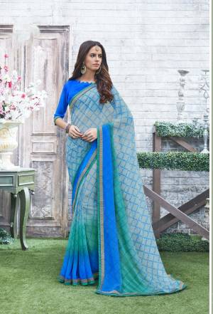 Look Pretty Wearing This Saree In Light Blue Color Paired With Royal Blue Colored Blouse. This Saree And Blouse Are Fabricated On Georgette Beautified With Prints All Over The Saree. Buy This Regular Wear Saree Now.