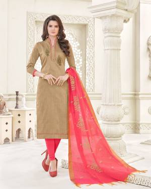 Simple And Elegant Looking Dress Material Is Here With Beige Colored Top Paired With Dark Peach Colored Bottom And Dupatta. Its Top And Bottom Are Fabricated On Cotton Paired With Banarasi Art Silk Dupatta. Get This Stitched As Per Your Desired Fit And Comfort.