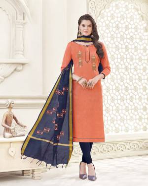 A Must Have Shade In Every Womens Wardrobe Is Here With This Dress Material In Peach Colored Top Paired With Contrasting Navy Blue Colored Bottom And Dupatta. Its Top And Bottom Are Fabricated On Cotton Paired With Banarasi Art Silk Dupatta. 