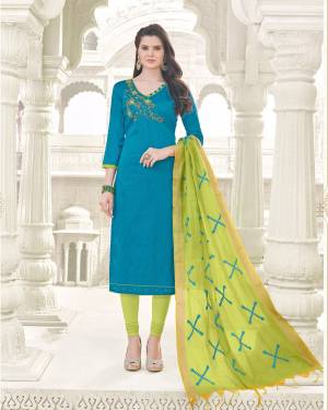 Grab This Simple Dress Material For Your Casual Or Semi-Casual Wear In Blue Colored Top Paired With Contrasting Green Colored Bottom And Dupatta. Its Top And Bottom Are Fabricated On Cotton Paired With Banarasi Art Silk Dupatta. Buy This Suit Now.