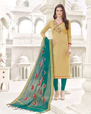 Simple And Elegant Looking Dress Material Is Here With Beige Colored Top Paired With Teal Green Colored Bottom And Dupatta. Its Top And Bottom Are Fabricated On Cotton Paired With Banarasi Art Silk Dupatta. Get This Stitched As Per Your Desired Fit And Co