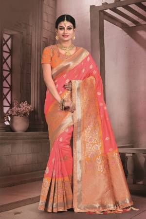 Bright Colors Gives An Attractive Look To Your Personaliy, So Grab This Bright Saree In Dark Peach Color Paired With Orange Colored Blouse. This Saree And Blouse Are Fabricated On Art Silk Beautified With Weave. It Is Durable And Easy To Care For.