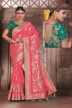 Look Pretty Wearing This Saree In Dark Pink Color Paired With Contrasting Teal Green Colored Blouse. This Saree And Blouse Are Fabricated On Art Silk Beautified With Weave Over the Saree And Embroidered Blouse.  Buy This Saree Now.
