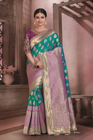 New And Unique Shade In Blue IS Here With This Silk Saree In Teal Blue Color Paired With Contrasting Purple Colored Blouse. This Saree And Blouse are Fabricated On Art Silk Beautified With Weave And Embroidered Blouse.