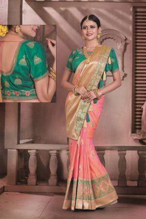 Here Is A Saree In Two Tone Silk In Peach And Pink Color Paired With Contrasting Teal Green Colored Blouse. This Saree And Blouse Are Fabricated On Art Silk Beautified With Weave. It Is Light Weight And Ensures Superb Comfort All Day Long. Buy Now.