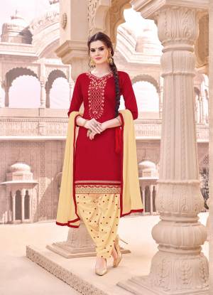 Forever Combination Is Here With This Dress Material In Red Colored Top Paired With Cream Colored Bottom And Dupatta. Its Top And Bottom Are Fabricated On Cotton Paired With Chiffon Dupatta. It Is Beautified With Thread Work Over The Top And Bottom.  Buy This Dress Material Now.