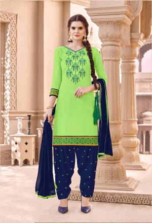 Be It Your Semi-Casual Or Festive Wear, This Pretty Suit Is Suitable For Both. This Dress Material Is In Green Colored Top Paired With Contrasting Navy Blue Colored Bottom And Dupatta. Its Top And Bottom Are Fabricated On Cotton Paired With Chiffon Dupatta. Buy Now.