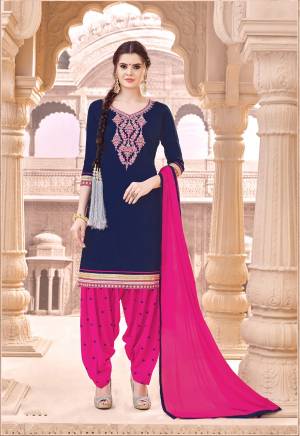 Enhance Your Personality Wearing This Suit In Navy Blue Colored Top Paired With Contrasting Dark Pink Colored Bottom And Dupatta. Its Top And Bottom Are fabricated On Cotton Paired With Chiffon Dupatta.  Its All Three Fabrics Ensures Superb Comfort All Day Long.