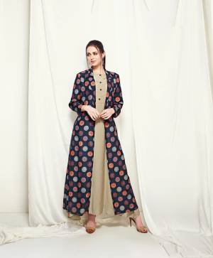 Enhance Your Personaity Wearing This Designer Readymade Kurti In Khaki Color Paired With Navy Blue Colored Jacket. This Kurti And Jacket Are Fabricated On Muslin Beautified With Pirnts. This Readymade Kurti Is Available In All Regular Sizes. Buy Now.