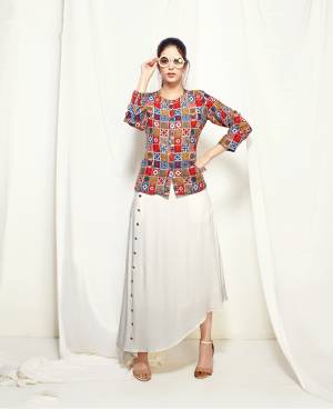 Simple And Elegant Looking Kurti Is Here In White Color Paired With Multi Colored Jacket. This Pretty Jacket And Kurti Are Fabricated On Muslin Beautified With Prints. Its Fabric Ensures Superb Comfort All Day Long.