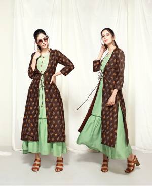 Add This Lovely Jacket Kurti To Your Wardrobe In Light Green Color Paired With Brown Colored Jacket. This Kurti And Jacket Are Fabricated On Muslin Beautified With Prints All Over. Buy This Designer Readymade Kurti Now.