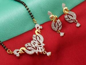Grab This Designer Heavy Mangalsutra In Golden Color Beautified With Diamonds All Over. This Mangalsutra Comes With A Set Of Matching Earrings. It Is Light In Weight And Easy To Carry Throughout The Gala.  Buy Now.