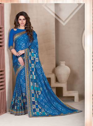 Grab This Attractive Saree In Blue Color Paired With Blue Colored Blouse. This Saree Is Fabricated On Chiffon Brasso Paired With Art Silk Fabricated Blouse. It Is Beautified With Prints All Over. Buy This Saree Now.