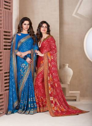 Adorn The Angelic Look Wearing This Saree In Red Color Paired With Red Colored Blouse. This Saree Is Fabricated On Chiffon Brasso Paired With Art Silk Fabricated Blouse. It Is Light In Weight And Easy To Carry All Day Long.