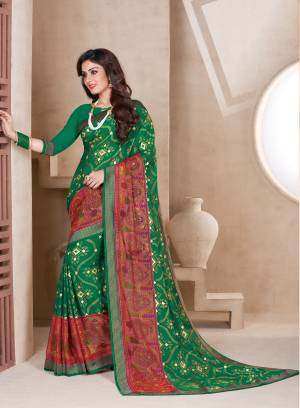 Celebrate This Festive Season Wearing This Saree In Green Color Paired With Green Colored Blouse. This Saree Is Fabricated On Chiffon Brasso Paired With Art Silk Fabricated Blouse. It Is Easy To Drape And Also Durable. Buy Now.