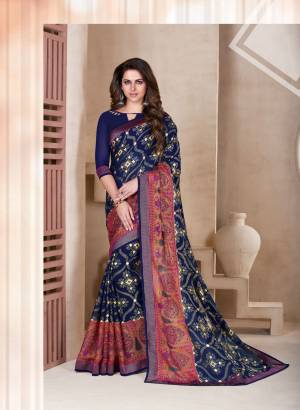 Enhance Your Personality Wearing This Saree In Navy Blue Color Paired With Navy Blue Colored Blouse. This Saree Is Fabricated On Chiffon Brasso Paired With Art Silk Fabricated Blouse. It Has Prints All Over The Saree.