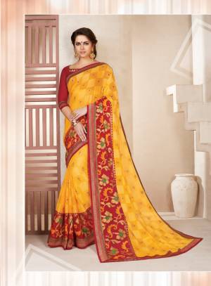 Here Is A Proper Traditional Look With This Saree In Yellow Color Paired With Contrasting Red Colored Blouse. This Saree Is Fabricated On Chiffon Brasso Paired With Art Silk Fabricated Blouse. Its Bright Color Combination Will Give You An Attractive Look.