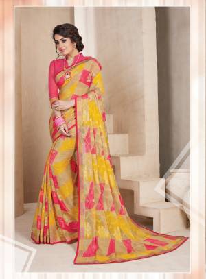 Go Colorful Wearing This Saree In Beige, Pink and Yellow Paired With Pink Colored Blouse. This Saree Is Fabricated On Chiffon Brasso Paired With Art Silk Fabricated Blouse. It Is Easy To Drape And Light In Weight. Buy This Saree Now.