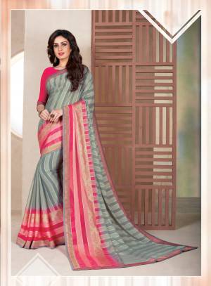 Flaunt Your Rich and Elegant Taste Wearing This Lovely Saree In Grey Color Paired With Dark Pink Colored Blouse. This Saree Is Fabricated On Chiffon Brasso Paired With Art Silk Fabricated Blouse. Buy This Elegant Looking Saree Now.