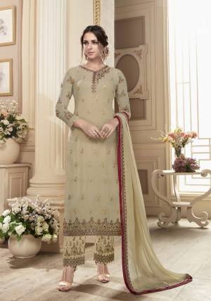 Simple And Elegant Looking Designer Straight Suit Is Here In Beige Color Paired With Beige Colored Bottom And Dupatta. Its Top Is Fabricated On Georgette Paired With Santoon Bottom And Chiffon Dupatta. This Pretty Will earn You Lots Of Compliments From Onlookers.