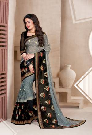 Enhance Your Personality Wearing This Saree In Grey And Black Color Paired With Black Colored Blouse. This Saree Is Fabricated On Chiffon Brasso Paired With Art Silk Fabricated Blouse. Its Bold Color Combination Will Earn You Lots Of Compliments From Onlookers.