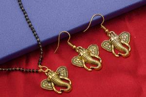 Here Is An Attractive Traditonal Patterned Mangalsutra Set In Golden Color. This Mangalsutra Comes With A Pair Of Earrings Beautified With Moti Work. This Unique Patterned Mangalsutra Will Earn You Lots Of Compliments From Onlookers. Buy Now.