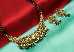 Here Is An Attractive Traditonal Patterned Mangalsutra Set In Golden Color. This Mangalsutra Comes With A Pair Of Earrings Beautified With Moti Work. This Unique Patterned Mangalsutra Will Earn You Lots Of Compliments From Onlookers. Buy Now.