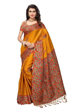 Celebrate This Festive Season With Beauty And Comfort Wearing This Saree In Musturd Yellow Color Paired With Contrasting Red Colored Blouse. This Saree And Blouse Are Fabricated On Kashmiri Art Silk Beautified With Floral Prints Over The Border And Blouse.