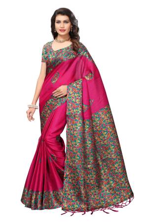 Attract All Wearing This Saree In Rani Pink Color Paired With Contrasting Turquoise Blue Colored Blouse. This Saree And Blouse Are Fabricated On Kashmiri Art Silk Beautified With Prints All Over.
