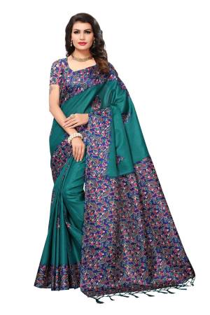 New Shade In Blue Is Here With This Silk Saree In Teal Blue Color Paired With Blue Colored Blouse. This Saree And Blouse Are Fabricated On Kashmiri Art Silk Beautified With Multi Colored Floral Prints. 