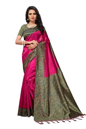 Attract All Wearing This Saree In Rani Pink Color Paired With Contrasting Green Colored Blouse. This Saree And Blouse Are Fabricated On Kashmiri Art Silk Beautified With Prints All Over.