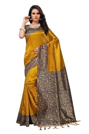 You Will Definitely Earn Lots Of Compliments Wearing This Attractive Looking Saree In Yellow Color Paired With Contrasting Navy Blue Colored Blouse. This Saree And Blouse Are Fabricated On Kashmiri Art Silk. Buy Now.