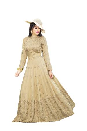 Flaunt Your Rich and Elegant Taste Wearing this Designer Floor Length Readymade Gown In Beige Color Fabricated On Cotton Silk. This Pretty Elegant Looking Gown Is Beautified With Resham Embroidery And Stone Work. 