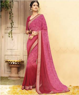 Look Pretty Wearing This Saree In Pink And Dark Pink color Paired With Dark Pink Colored Blouse. This Saree And Blouse Are Fabricated On Georgette Beautified With Small Prints All Over The Saree. Buy Now.