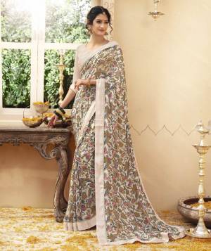 Flaunt Your Rich And Elegant Taste Wearing This Saree In Off-White Color Paired With Off-White Colored Blouse. This Saree And Blouse Are Fabricated On Georgette Beautified With Pretty Prints And Lace Border. 