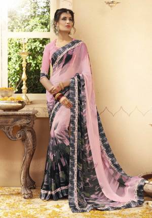 Add This Lovely Saree To Your Wardrobe In Baby Pink color Paired With Baby Pink Colored Blouse. This Saree And Blouse Are Fabricated On Georgette Beautified With Contrasting Prints. This Saree Is Light Weight And Durable Which Is Easy To Carry All day Long.