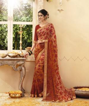 Orange Color Induces Perfect Summery Appeal To Any Outfit, So Grab This Saree In Rust Orange Color Paired With Rust Orange Colored Blouse. This Saree And Blouse Are Fabricated On Georgette Beautified With Printed And Lace Border. Buy This Saree Now.