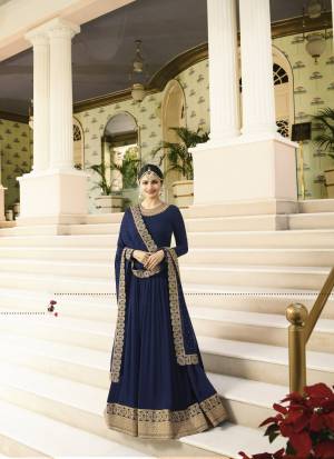 Enhance Your Personality Wearing This Rich And Royal Looking Designer Floor Length Suit In Navy Blue Colored Top Paired With Navy Blue Colored Bottom And Dupatta. Its Top Is Fabricated On Georgette Paired With Santoon Bottom And Chiffon Dupatta. This Heavy Designer Suit Will Earn You Lots Of Compliments From Onlookers. Buy Now.