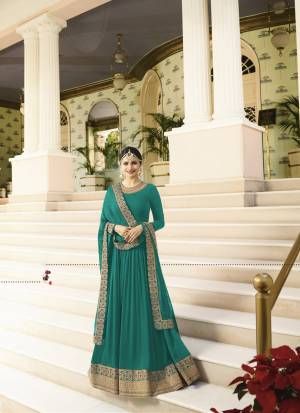 Enhance Your Personality Wearing This Rich And Royal Looking Designer Floor Length Suit In Teal Blue Colored Top Paired With Teal Blue Colored Bottom And Dupatta. Its Top Is Fabricated On Georgette Paired With Santoon Bottom And Chiffon Dupatta. This Heavy Designer Suit Will Earn You Lots Of Compliments From Onlookers. Buy Now.