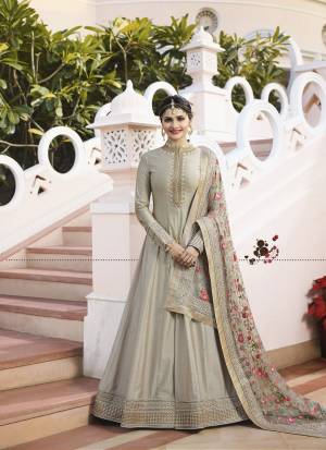 Flaunt Your Rich And Elegant Taste Wearing This Designer Floor Length Suit In Grey Colored Top Paired With Grey Colored Bottom And Grey Colored Dupatta. Its Top IS Fabricated On Art Paired With Santoon Bottom And Designer Net Fabricated Embroidered Dupatta. Buy Now