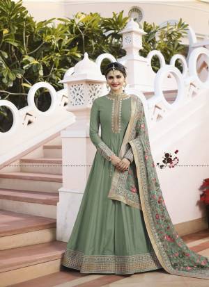 Flaunt Your Rich And Elegant Taste Wearing This Designer Floor Length Suit In Mint Green Colored Top Paired With Mint Green  Colored Bottom And Grey Colored Dupatta. Its Top IS Fabricated On Art Paired With Santoon Bottom And Designer Net Fabricated Embroidered Dupatta. Buy Now