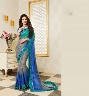 Simple And Elegant Looking Saree Is Here In White, Black And Blue Color Paired With Blue Colored Blouse. This Saree Is Fabricated On Silk Georgette Paired With Art Silk Fabricated Blouse. Buy This Saree Now.